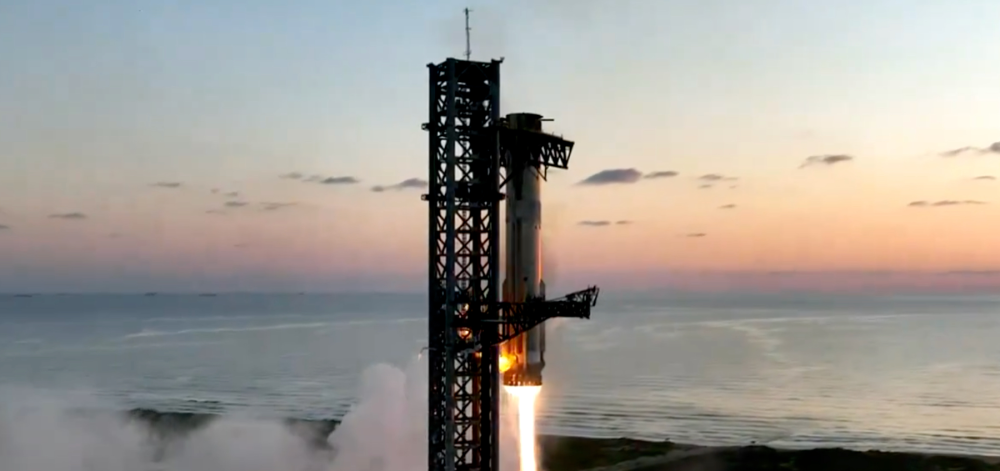 Two giant mechanical arms catching the SpaceX's Super Heavy booster on the first attempt in October 2024. SpaceX